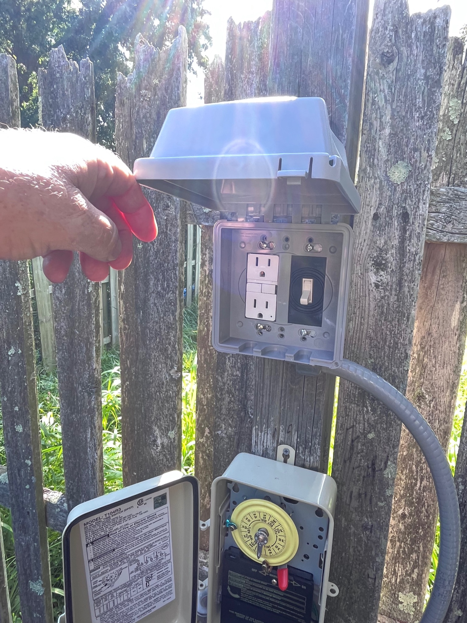 Outdoor electrical outlet and timer installation